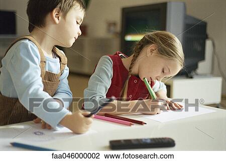 Siblings drawing with colored pencils, little boy pausing to look over sister's shoulder View Large Photo Image Stock Image - Siblings drawing with colored pencils, little boy pausing to look over sister's shoulder. Fotosearch