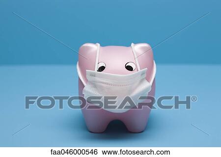 Stock Photograph - Swine flu concept, toy pig wearing flu mask. Fotosearch