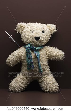 Syringe sticking out of teddy bear View Large Photo Image Stock Image - Syringe sticking out of teddy bear. Fotosearch