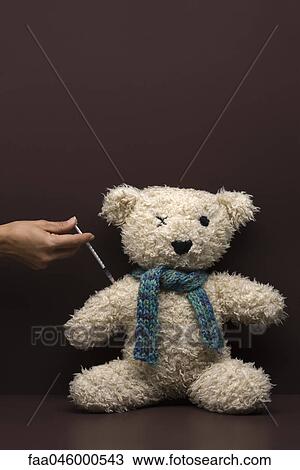 Stock Image - Teddy bear getting a shot. Fotosearch