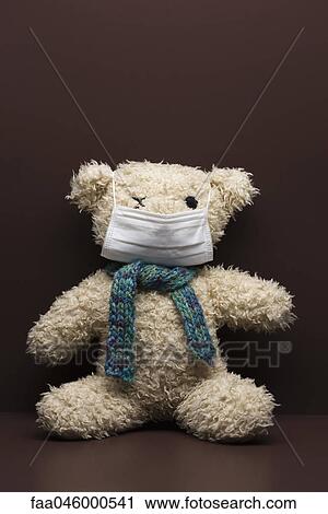 Teddy bear wearing flu mask View Large Photo Image Stock Image - Teddy bear wearing flu mask. Fotosearch