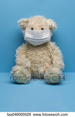 Stock Photo - Teddy bear wearing flu mask. Fotosearch