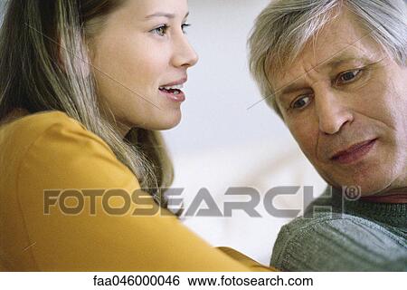 Teenage girl talking with grandfather View Large Photo Image Stock Photograph - Teenage girl talking with grandfather. Fotosearch