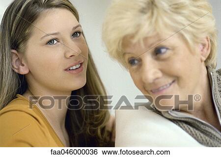 Teenage girl talking with grandmother View Large Photo Image Stock Photograph - Teenage girl talking with grandmother. Fotosearch