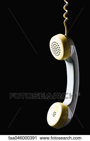 Telephone receiver hanging by cord View Large Photo Image Stock Image - Telephone receiver hanging by cord. Fotosearch