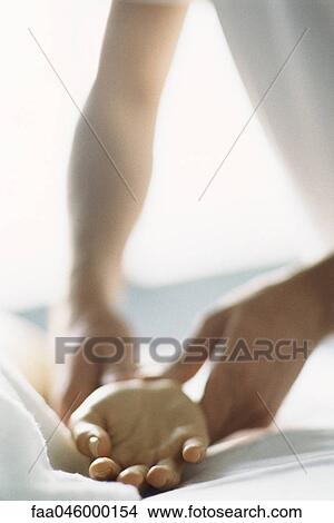 Therapist treating patient's wrist, cropped View Large Photo Image Picture - Therapist treating patient's wrist, cropped. Fotosearch