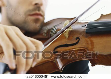Violinist playing violin, cropped View Large Photo Image Stock Image - Violinist playing violin, cropped. Fotosearch