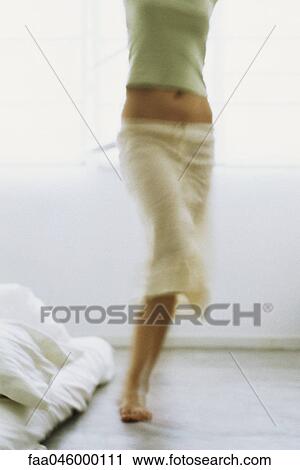 Stock Image - Woman dancing, low section. Fotosearch