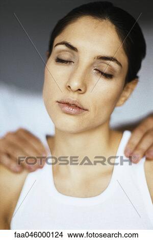 Woman enjoying shoulder massage View Large Photo Image Picture - Woman enjoying shoulder massage. Fotosearch