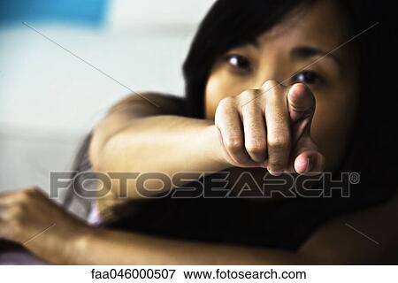 Woman pointing accusingly at camera View Large Photo Image Stock Photo - Woman pointing accusingly at camera. Fotosearch
