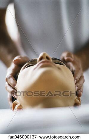 Woman receiving head massage View Large Photo Image Stock Photo - Woman receiving head massage. Fotosearch