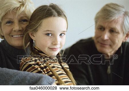 Young girl with grandparents, portrait View Large Photo Image Stock Photo - Young girl with grandparents, portrait. Fotosearch