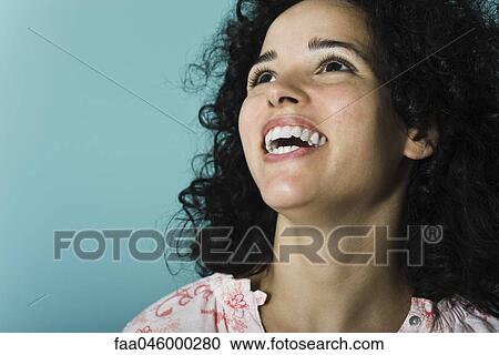 Young woman laughing, portrait View Large Photo Image Stock Image - Young woman laughing, portrait. Fotosearch