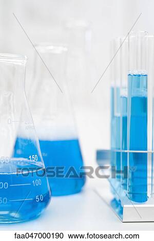 Beakers, test tubes containing blue liquid View Large Photo Image Stock Image - Beakers, test tubes containing blue liquid. Fotosearch