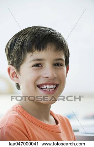 Stock Image - Boy smiling, portrait. Fotosearch