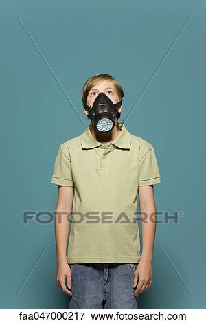 Stock Photo - Boy wearing gas mask. Fotosearch