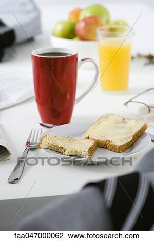 Breakfast consisting of buttered toast, coffee and orange juice View Large Photo Image Stock Image - Breakfast consisting of buttered toast, coffee and orange juice. Fotosearch