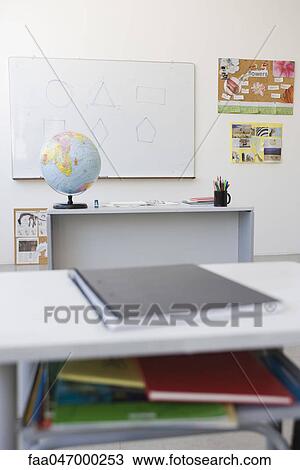 Classroom, school desk full of books and notebooks View Large Photo Image Stock Image - Classroom, school desk full of books and notebooks. Fotosearch