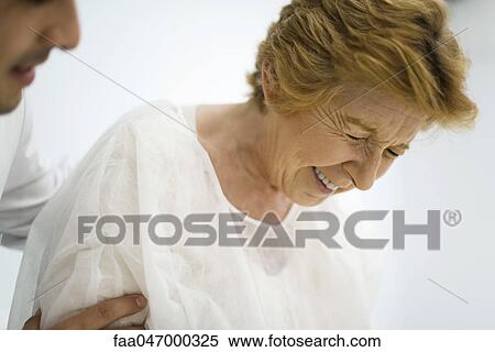 Doctor consoling upset patient, cropped View Large Photo Image Stock Photography - Doctor consoling upset patient, cropped. Fotosearch