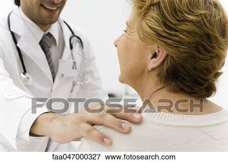 Doctor examining patient View Large Photo Image Stock Photo - Doctor examining patient. Fotosearch