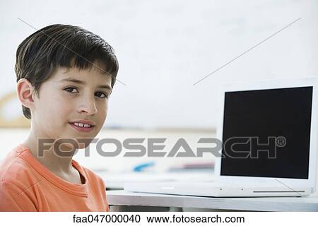 Stock Image - Elementary school student, portrait. Fotosearch