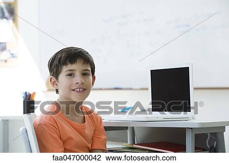 Stock Image - Elementary school student, portrait. Fotosearch