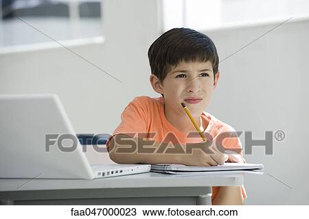 Elementary school student taking notes in class View Large Photo Image Stock Image - Elementary school student taking notes in class. Fotosearch