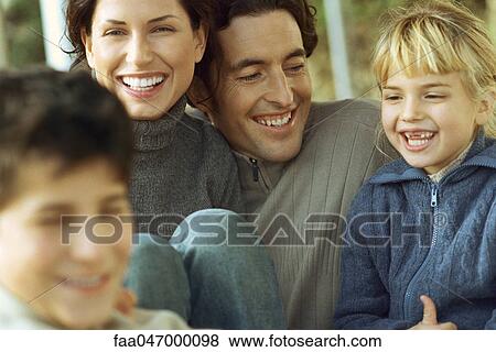 Stock Photo - Family laughing together. Fotosearch