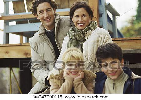 Stock Photography - Family together on deck, portrait. Fotosearch