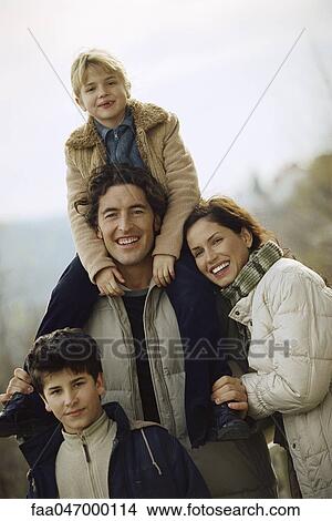 Picture - Family together outdoors, portrait. Fotosearch