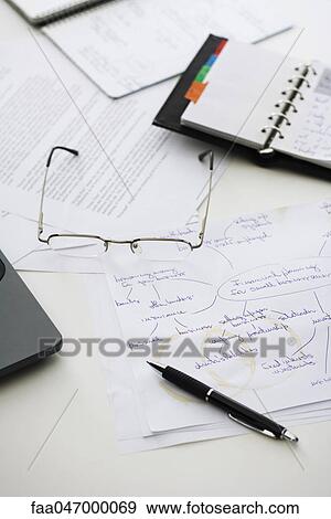 Hand written business plan on cluttered desk View Large Photo Image Stock Photo - Hand written business plan on cluttered desk. Fotosearch