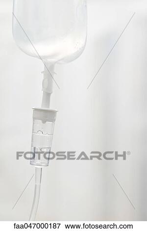 Stock Photo - IV drip, close-up of drip chamber. Fotosearch