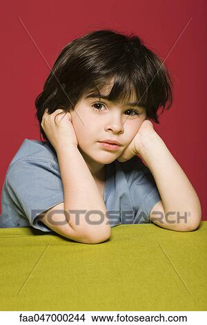 Little boy daydreaming, portrait View Large Photo Image Picture - Little boy daydreaming, portrait. Fotosearch
