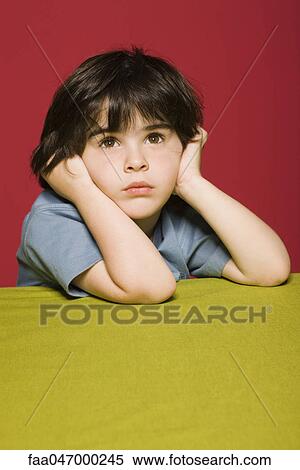 Little boy daydreaming, portrait View Large Photo Image Stock Photography - Little boy daydreaming, portrait. Fotosearch