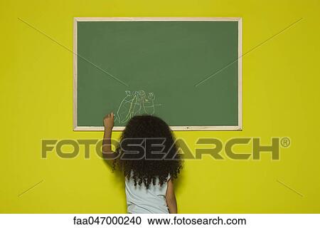 Little girl drawing on chalkboard, rear view View Large Photo Image Stock Image - Little girl drawing on chalkboard, rear view. Fotosearch