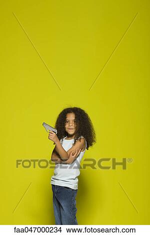 Little girl holding toy gun View Large Photo Image Picture - Little girl holding toy gun. Fotosearch