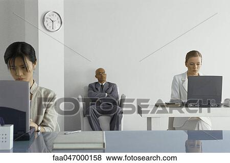 Manager supervising office workers View Large Photo Image Stock Photo - Manager supervising office workers. Fotosearch