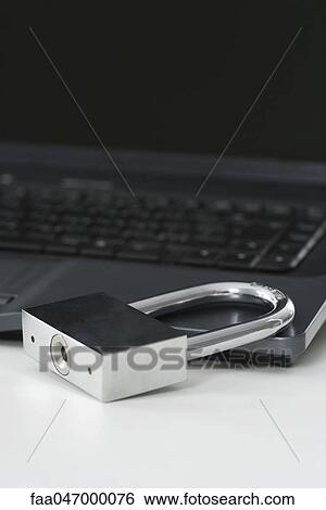 Stock Photograph - Padlock on laptop computer. Fotosearch