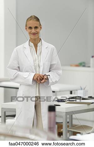 Science teacher standing in classroom, portrait View Large Photo Image Stock Photograph - Science teacher standing in classroom, portrait. Fotosearch