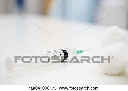 Syringe, cotton balls View Large Photo Image Stock Photography - Syringe, cotton balls. Fotosearch