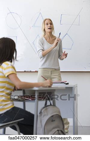 Teacher teaching geometry class View Large Photo Image Stock Photo - Teacher teaching geometry class. Fotosearch