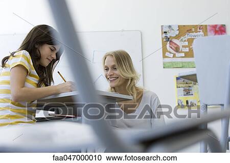 Teaching assisting student View Large Photo Image Stock Image - Teaching assisting student. Fotosearch