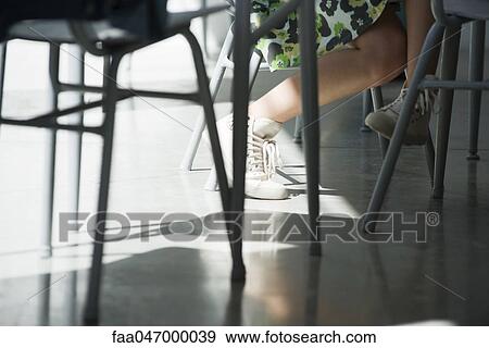 Teenage girl crossing legs, low section View Large Photo Image Stock Photo - Teenage girl crossing legs, low section. Fotosearch