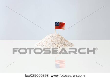 American flag sticking into pile of salt View Large Photo Image Stock Photo - American flag sticking into pile of salt. Fotosearch
