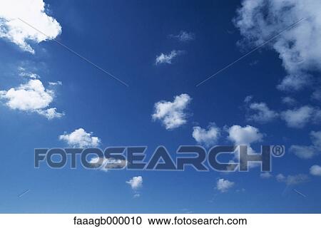 Blue sky with clouds View Large Photo Image Stock Image - Blue sky with clouds. Fotosearch