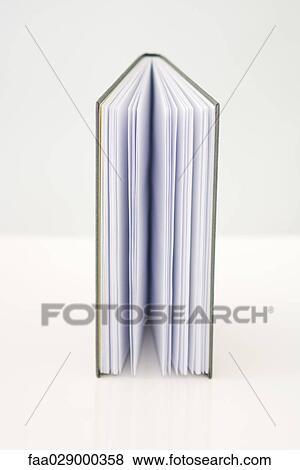 Book standing on end, half-opened, close-up View Large Photo Image Stock Photo - Book standing on end, half-opened, close-up. Fotosearch