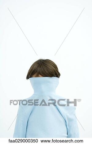 Boy with turtleneck pulled over face, portrait View Large Photo Image Stock Image - Boy with turtleneck pulled over face, portrait. Fotosearch