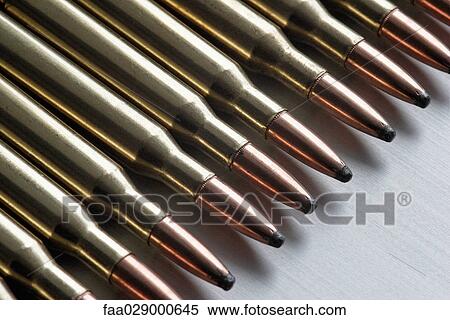 Bullets lined up, extreme close-up View Large Photo Image Stock Photography - Bullets lined up, extreme close-up. Fotosearch