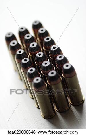Bullets lined up in rows, close-up View Large Photo Image Stock Photograph - Bullets lined up in rows, close-up. Fotosearch