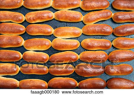 Buns baking, full frame View Large Photo Image Stock Image - Buns baking, full frame. Fotosearch